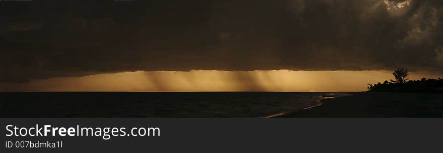 A panorama of a storm over the beach at Sanibel Island, Florida. A panorama of a storm over the beach at Sanibel Island, Florida