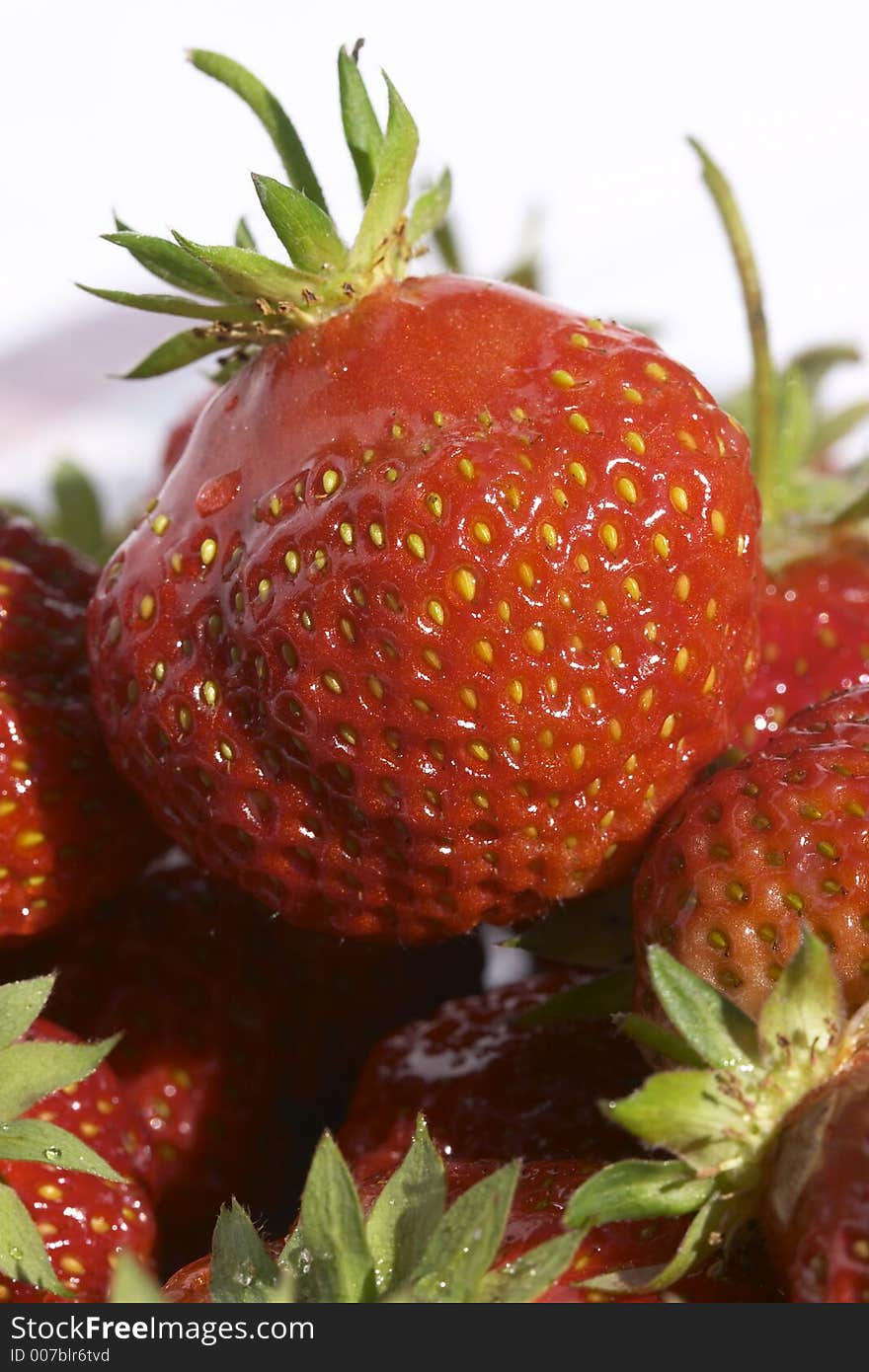 Strawberries on the white plate. Strawberries on the white plate