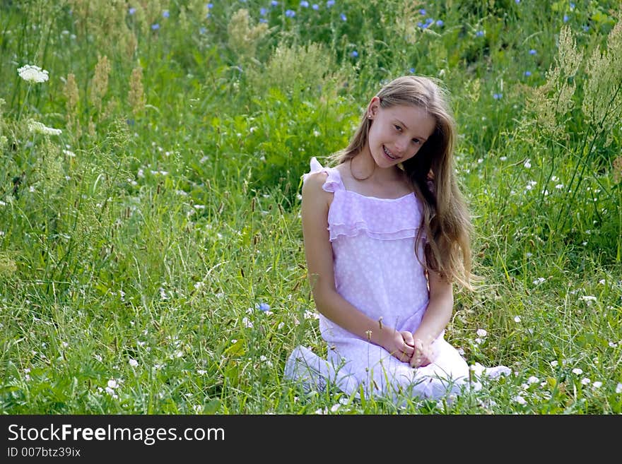 Beauty girl siting on grass