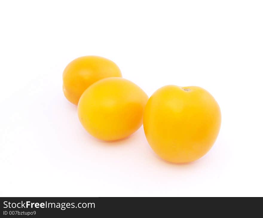 Three yellow tomatoes