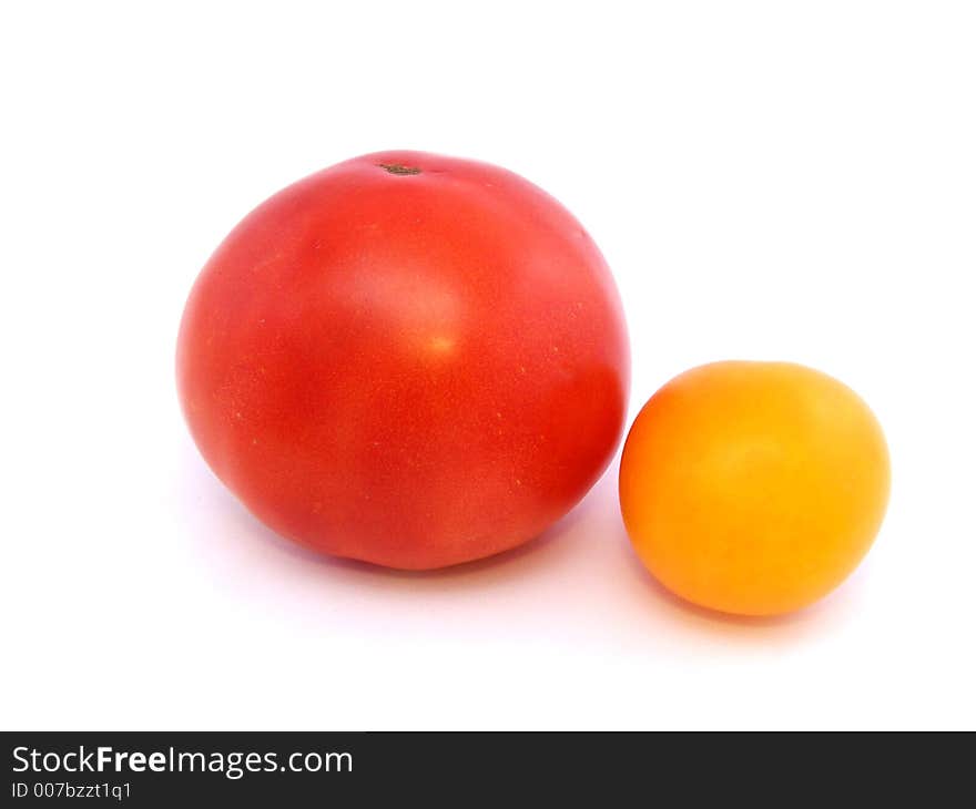 Big red and little yellow tomatoes. Big red and little yellow tomatoes