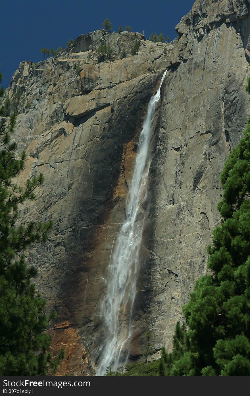 Yosemite Falls, California; framed by evergreens