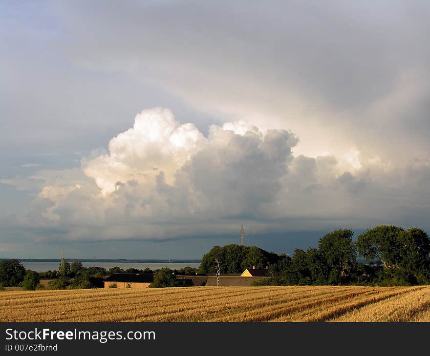 Dramatic clouds over a field