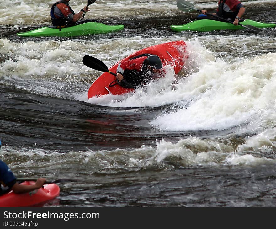 A group of guys on a river messing around in a hole. A group of guys on a river messing around in a hole.