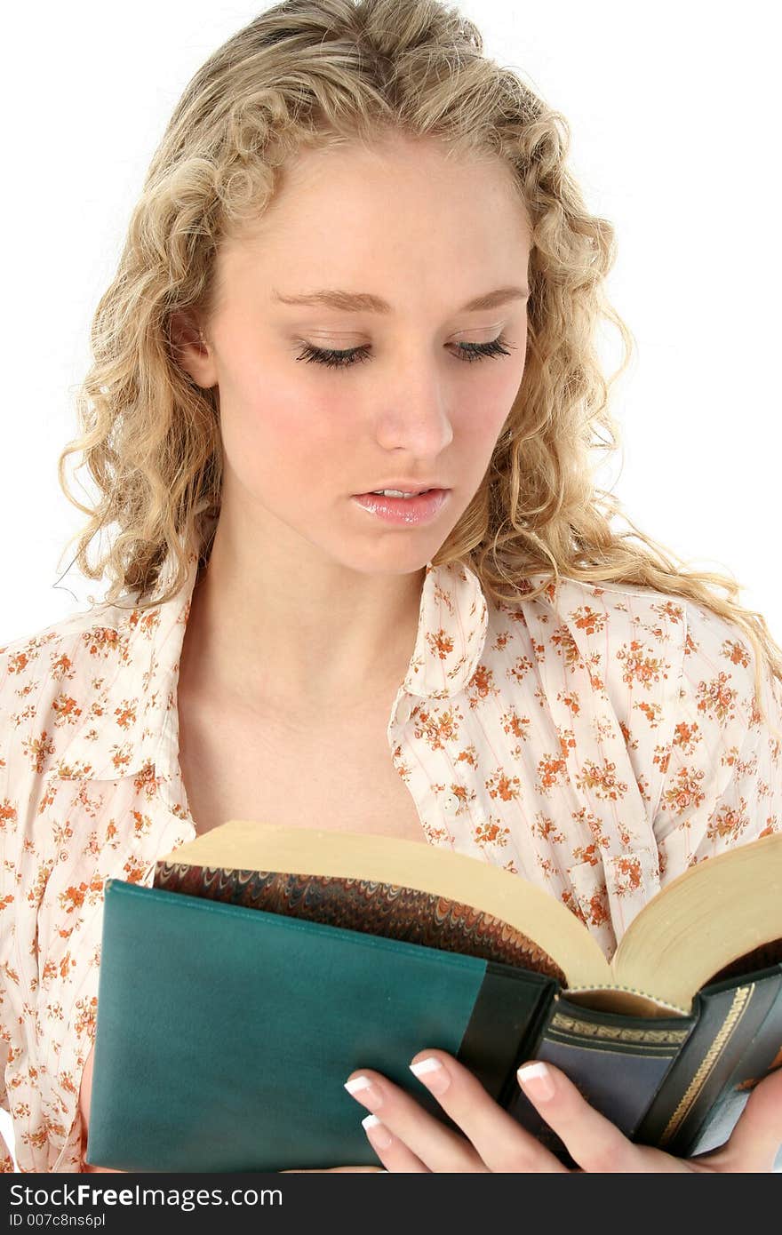 Beautiful teen girl reading.