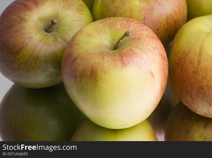 Group of apples on reflective surface. Group of apples on reflective surface