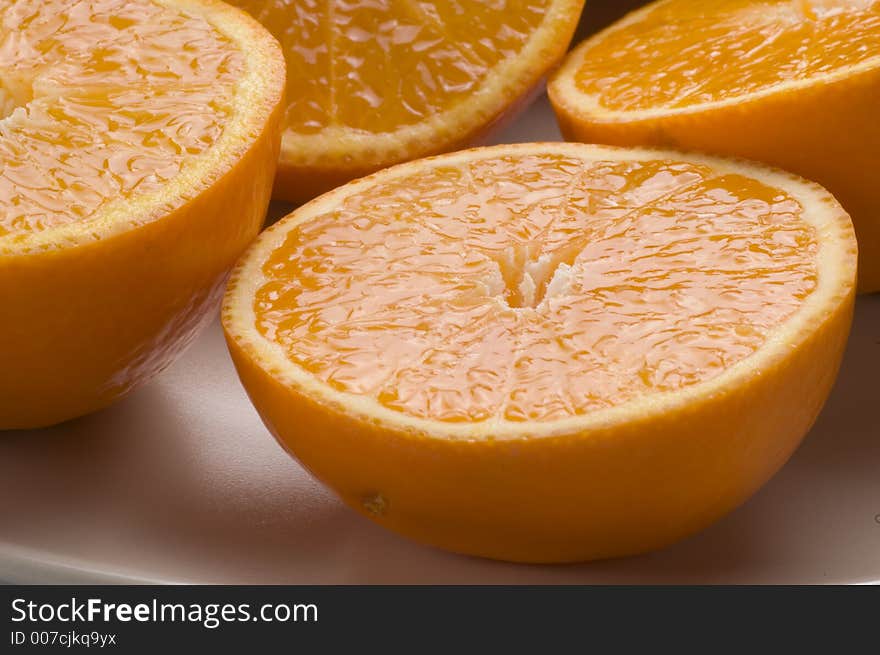 Close up of juicy oranges that have been halved