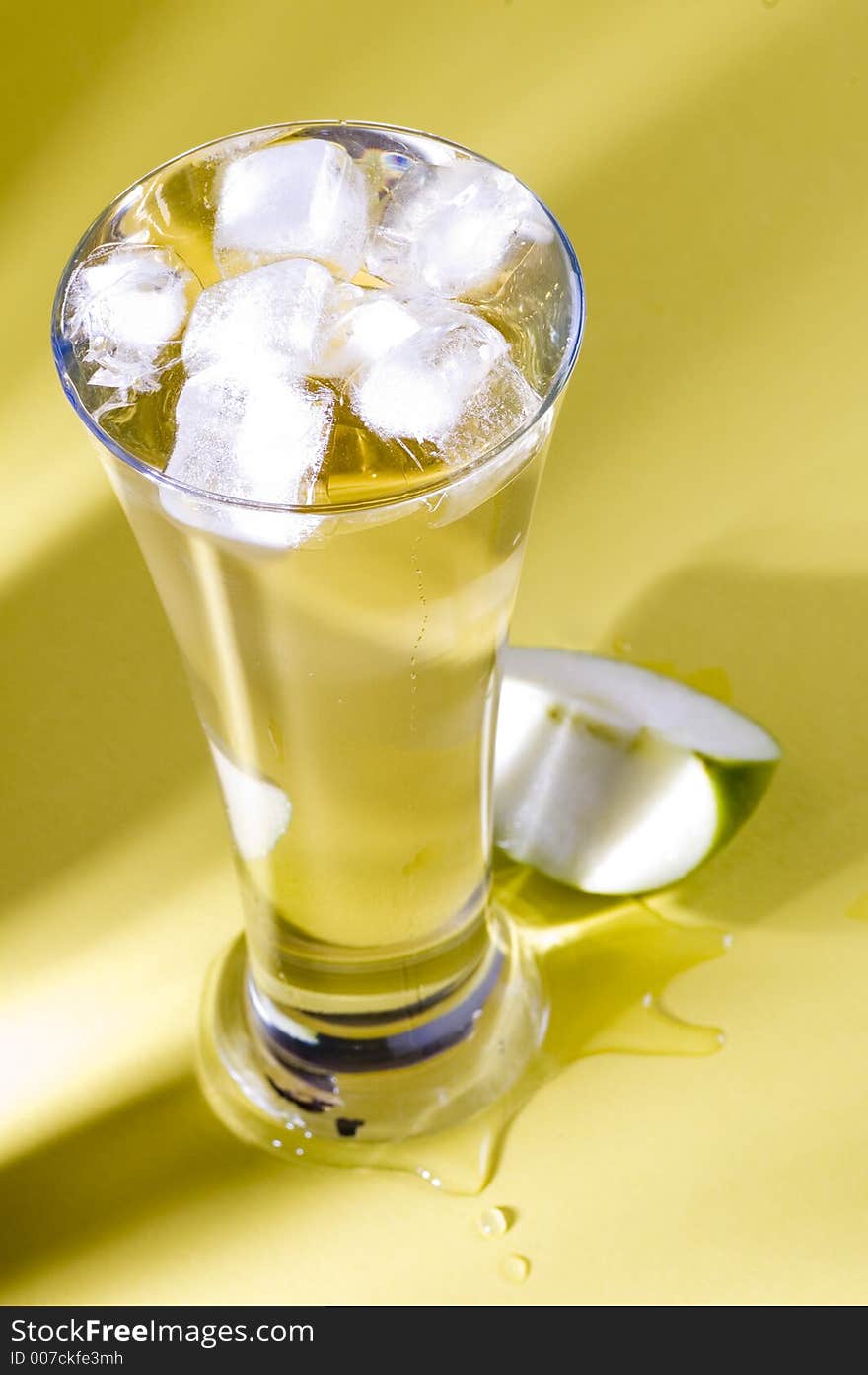 Isolated shot of a cool drink with apple piece. Isolated shot of a cool drink with apple piece