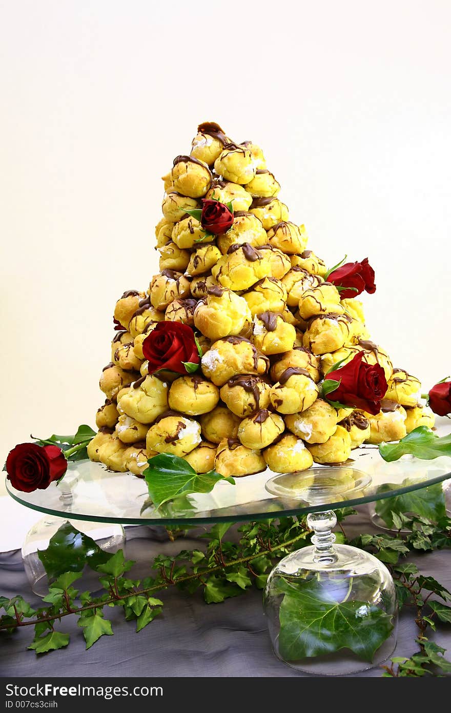 Small puff cakes stacked on glass plate. Small puff cakes stacked on glass plate