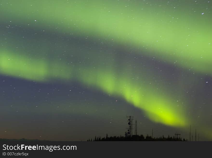 Northern lights over antenna complex on the hilltop. Northern lights over antenna complex on the hilltop