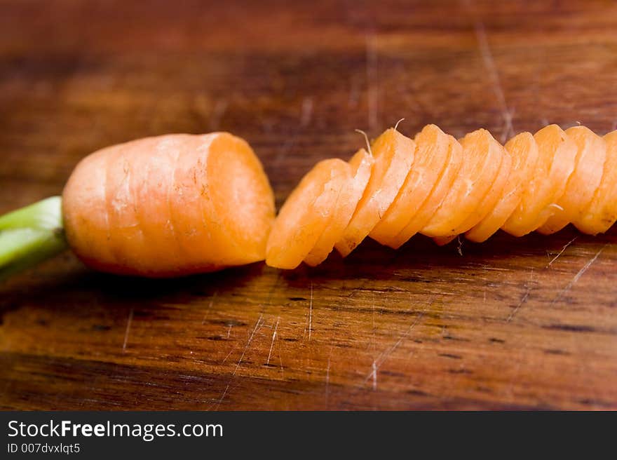 Chopped up carrot on a chopping board. Chopped up carrot on a chopping board