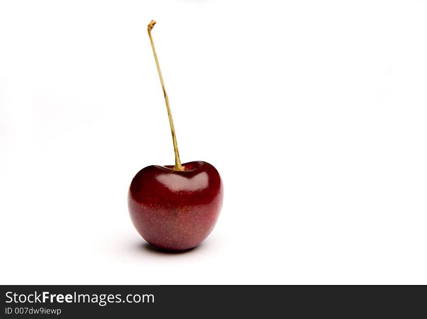 Isolated perfect juicy red cherry