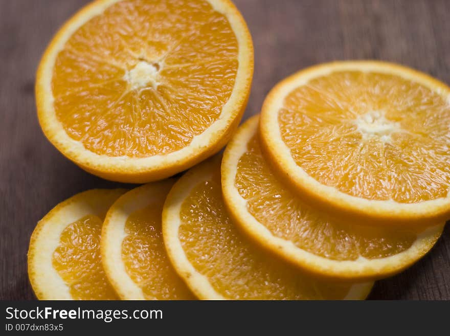 Sliced orange on a wooden surface