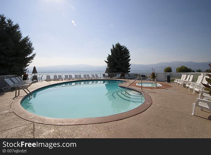 A picture of a resort pool and hot tub. A picture of a resort pool and hot tub.