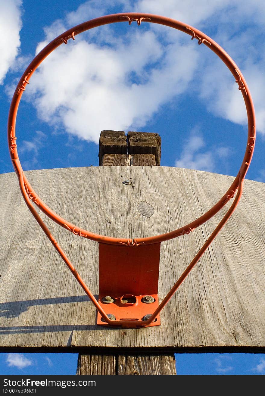 Looking up at sky through a basketball hoop. Looking up at sky through a basketball hoop