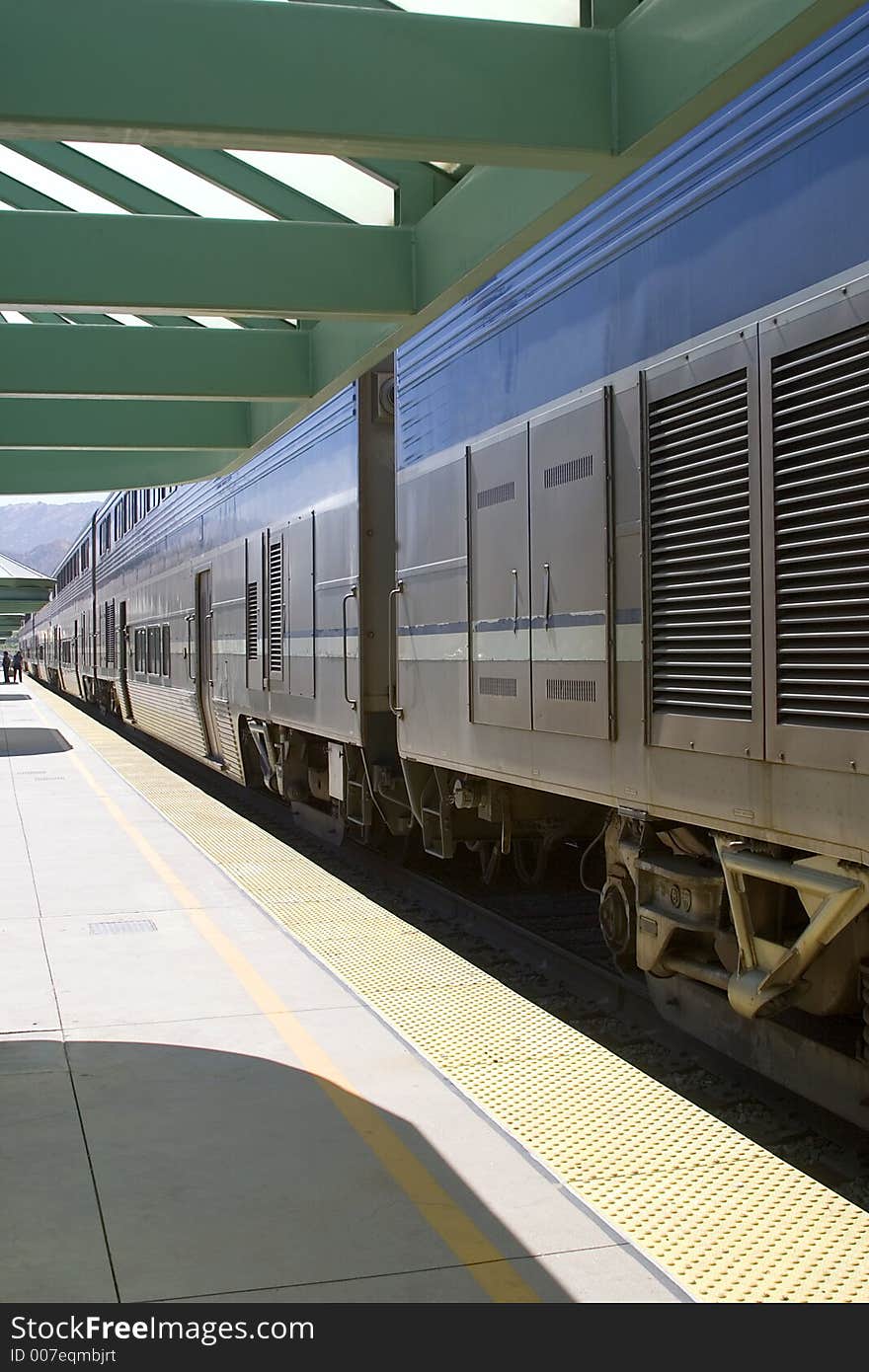 Train stopped at station to off load passengers. Train stopped at station to off load passengers.