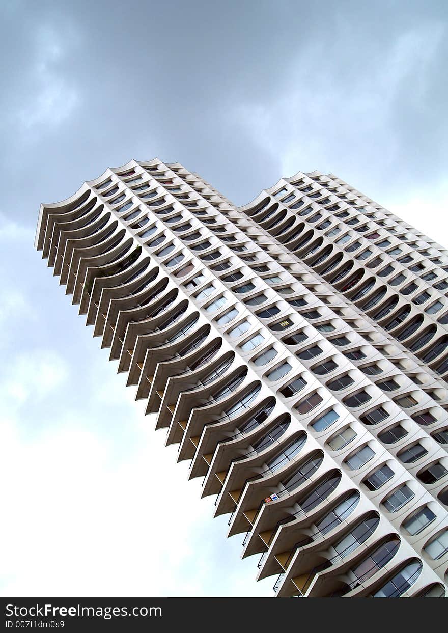 A white residential tower building