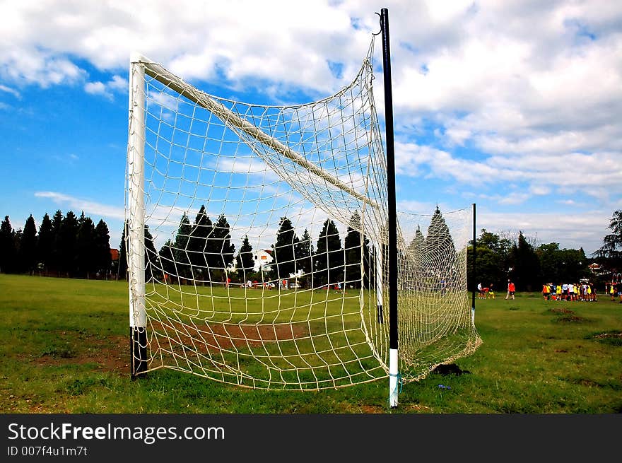 Soccer gate with clouds in background