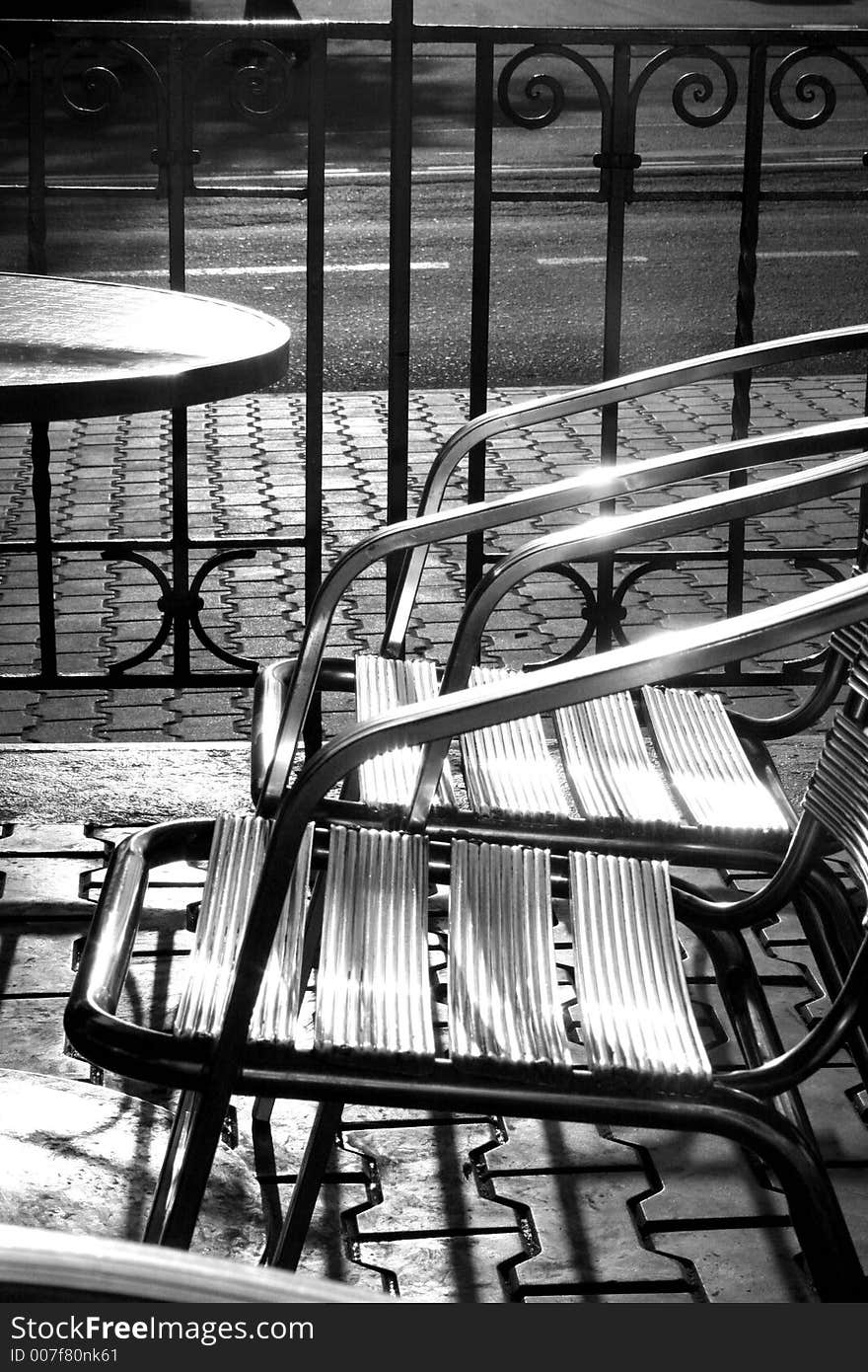 A couple of chairs caught the sun. A couple of chairs caught the sun