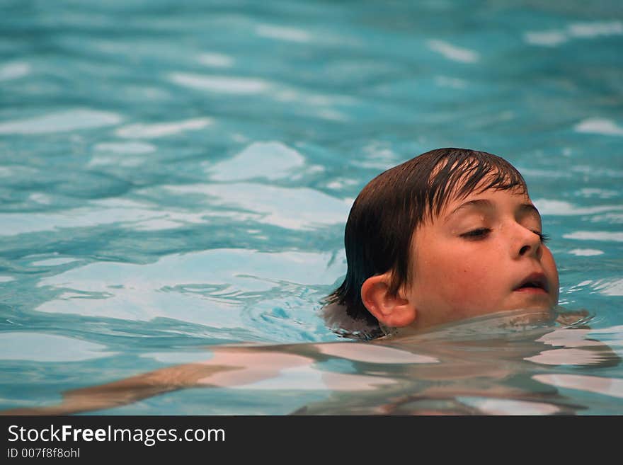 Child having fun swimming in pool. Child having fun swimming in pool