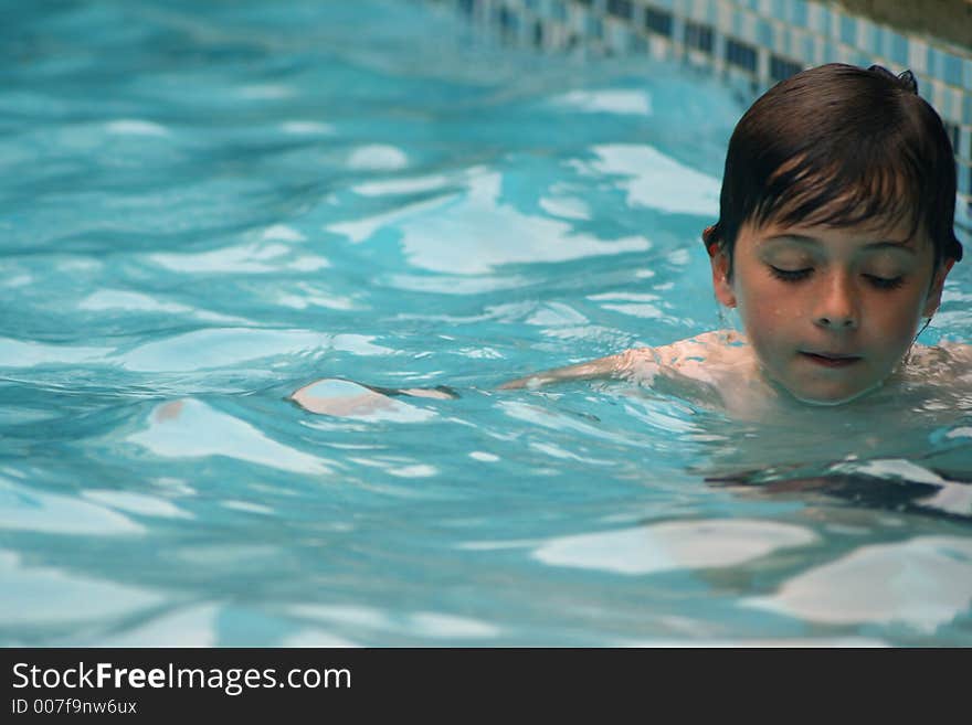 Child having fun swimming in pool. Child having fun swimming in pool