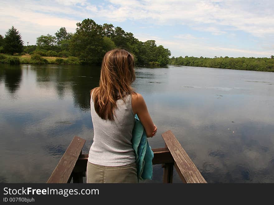 Woman looking out into Lake