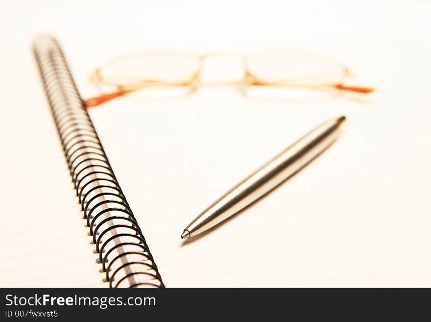 Pen pad glasses on a white background