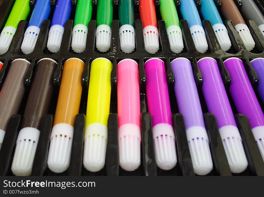 Close-up of colored marker pens on a black tray. Close-up of colored marker pens on a black tray