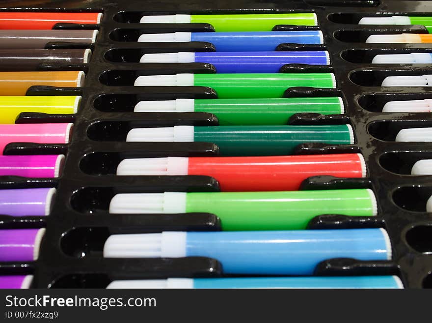 Close-up of colored marker pens on a black tray. Close-up of colored marker pens on a black tray