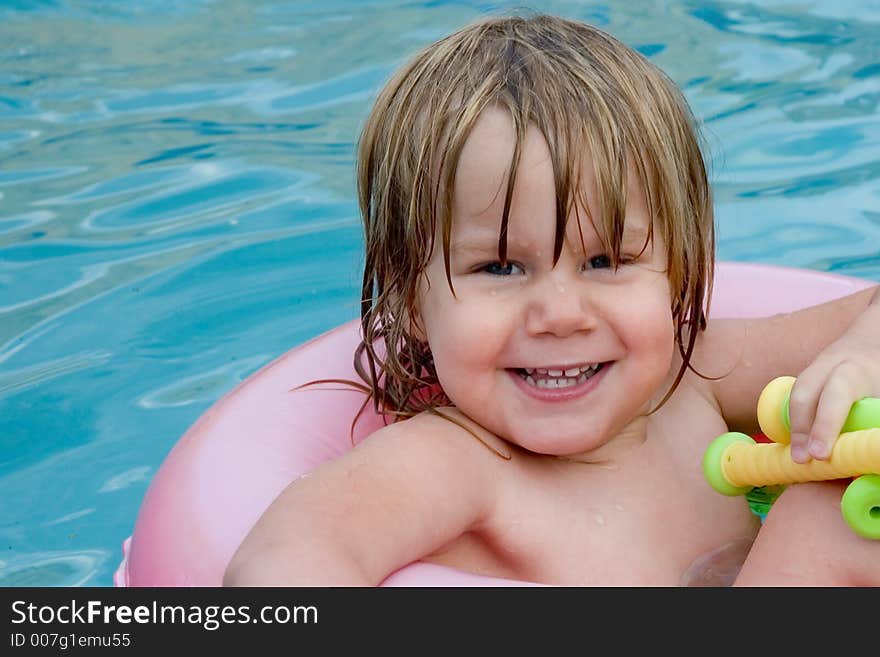 A little girl in a swimming pool. A little girl in a swimming pool