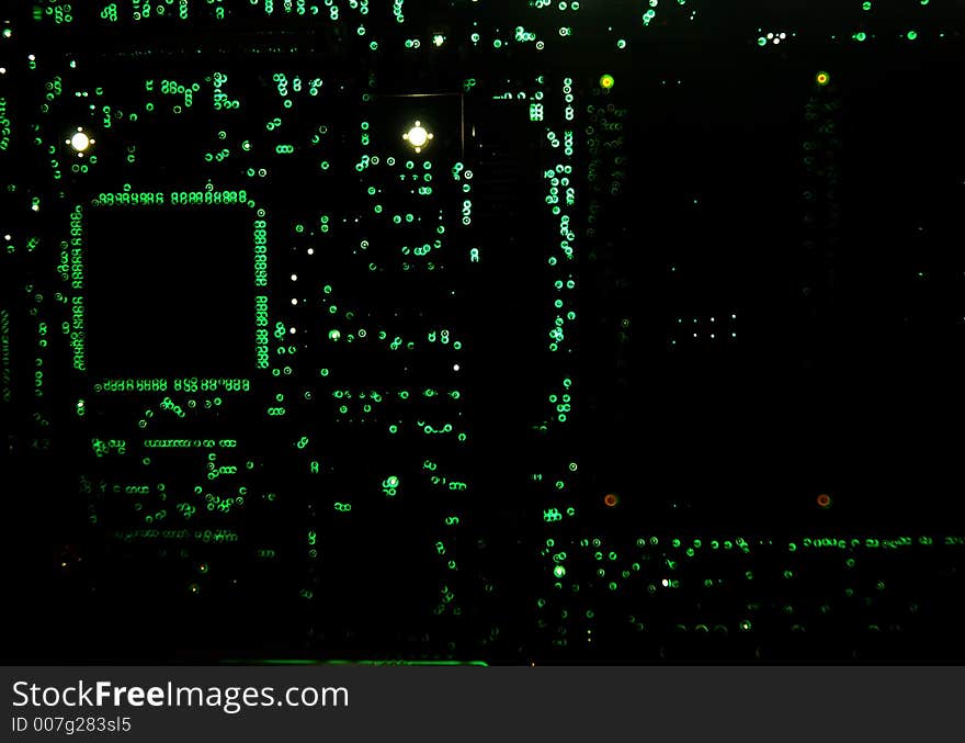 Backlit circuit board showing the various through-board solder points.