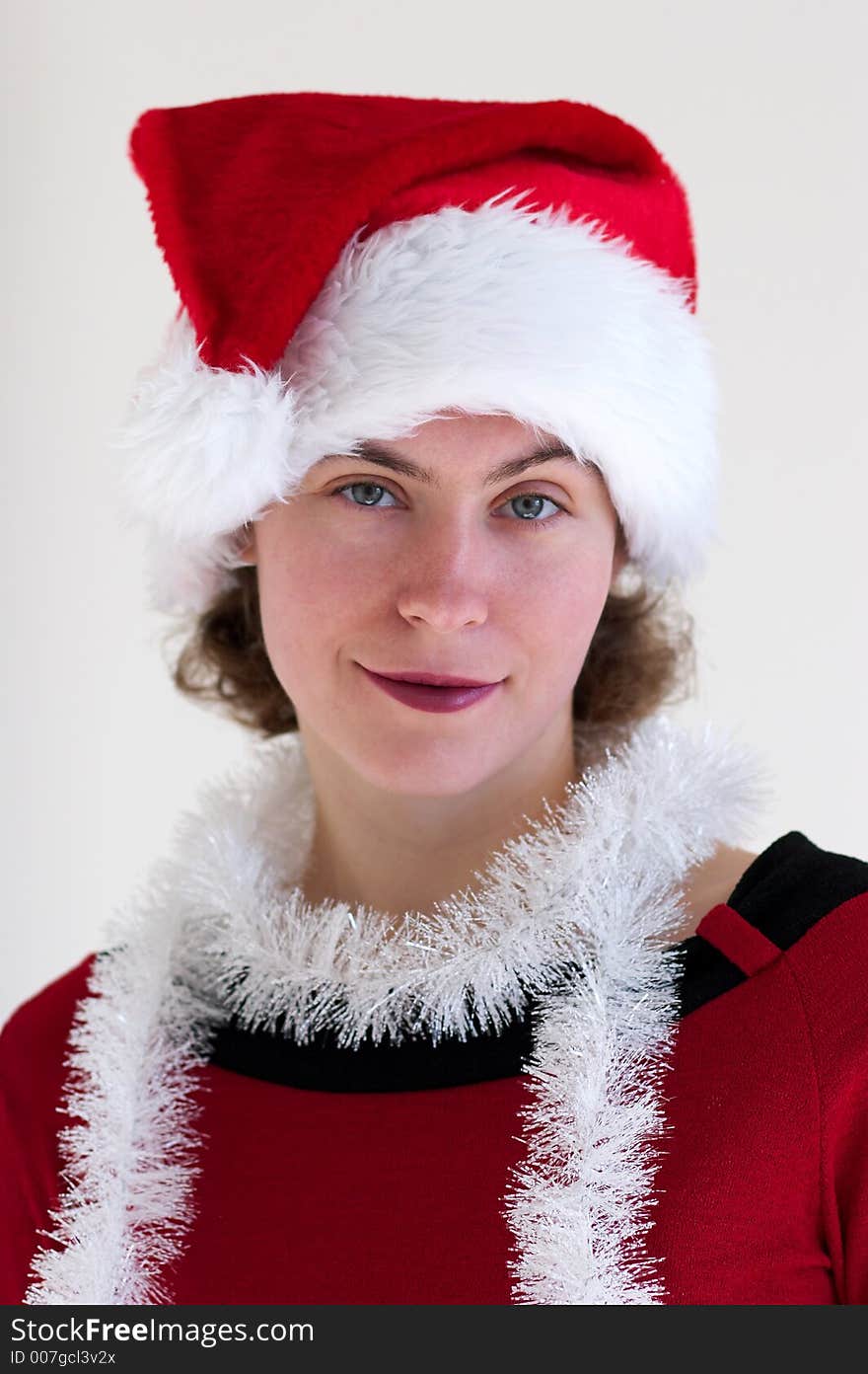 Portrait of young woman in santa's hat. Portrait of young woman in santa's hat