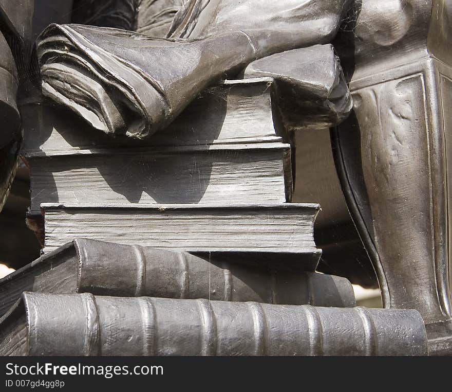 Statue stone books