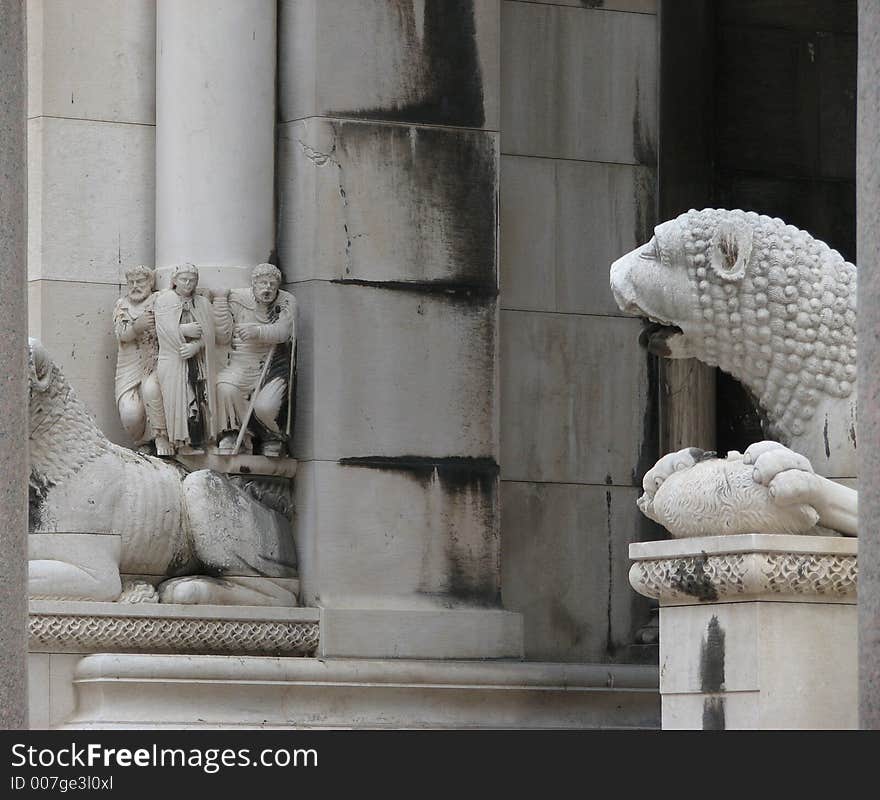 Saint is looking at angry lion. Saint is looking at angry lion