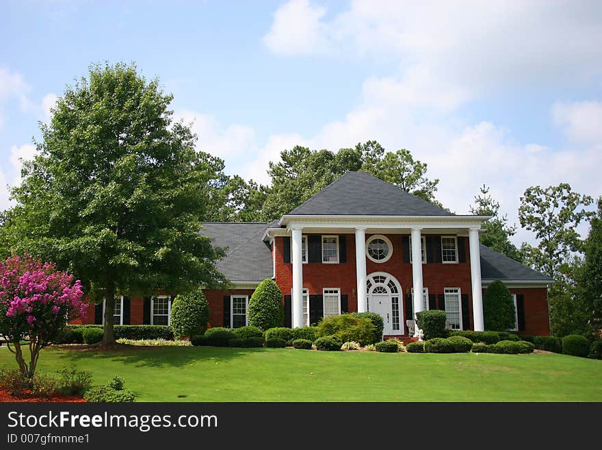 Nice brick house on street. Nice brick house on street