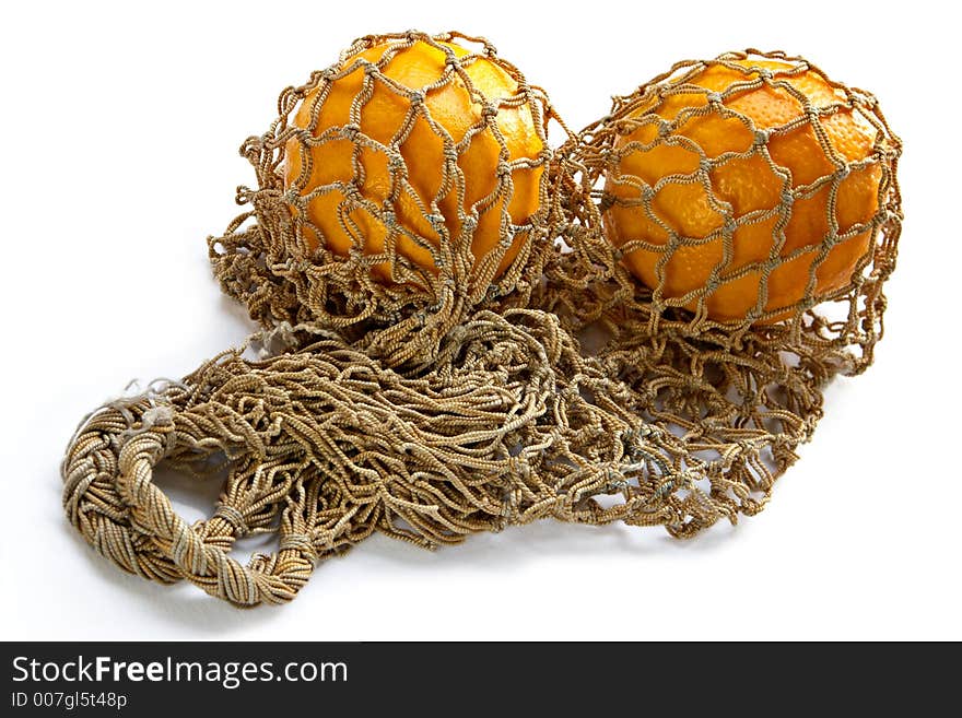 Two oranges in string-bag