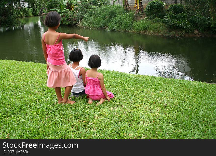 Three girls relaxing in the park. Three girls relaxing in the park.