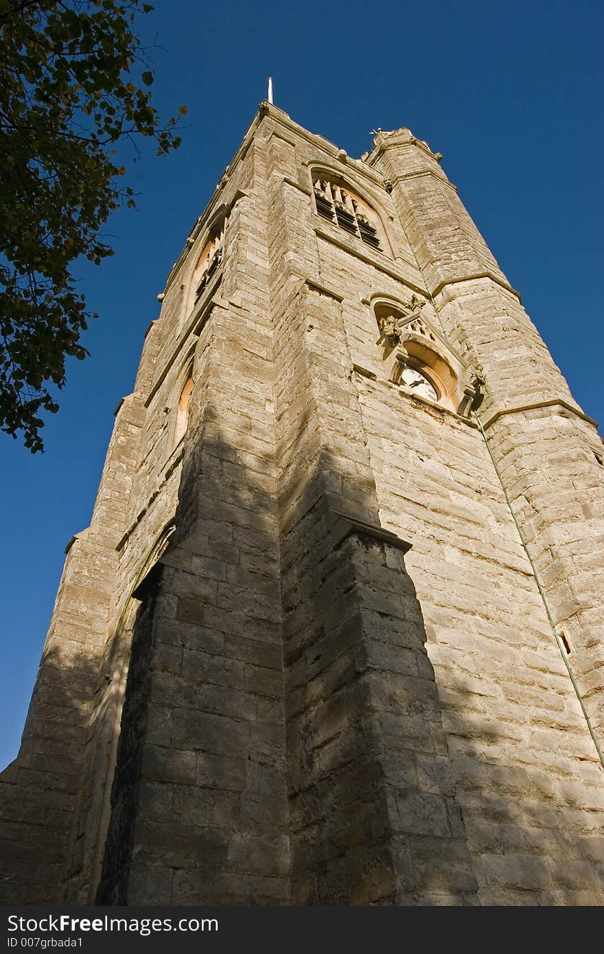 Looking up at a church spire on a summer day