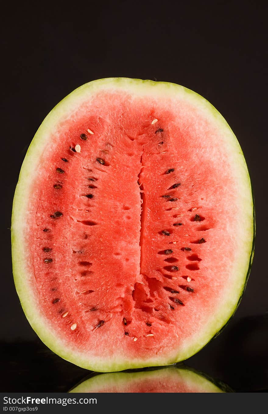 Red tasty watermelon over black