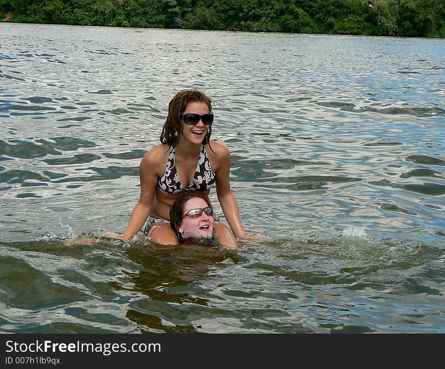 Two best friend sisters having fun in the lake. Two best friend sisters having fun in the lake.