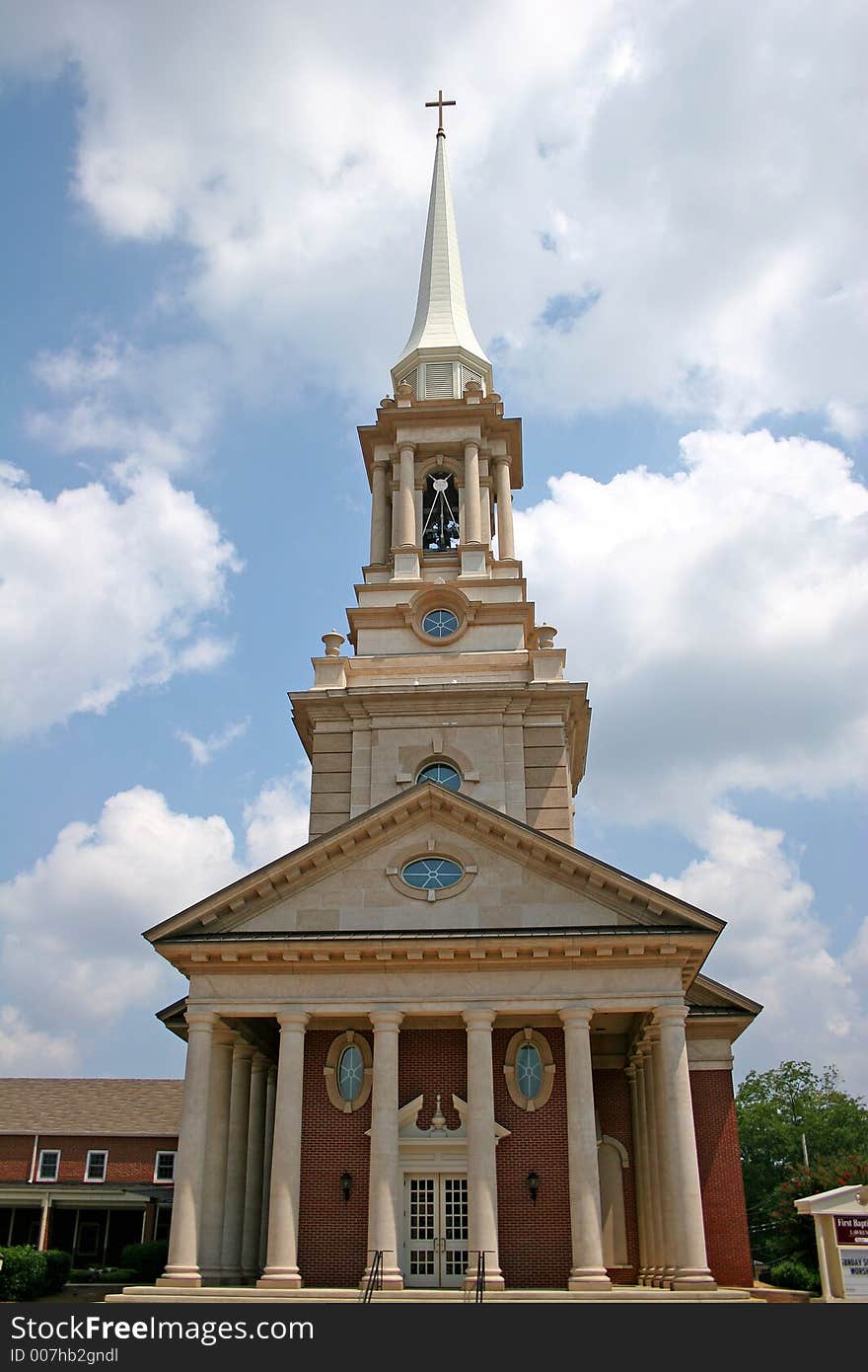 Large brick church against sky