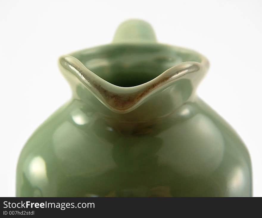 The spout of a green jug