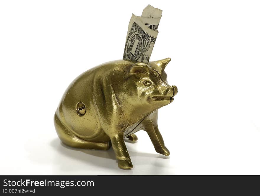 Photo of a Brass Piggy Bank With A Dollar Sticking Out. Photo of a Brass Piggy Bank With A Dollar Sticking Out