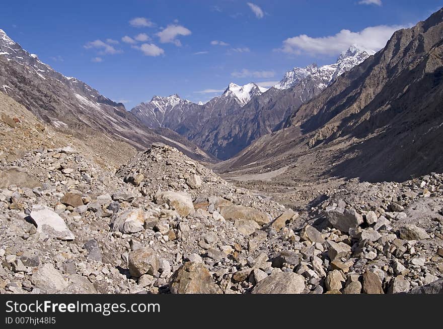 View onto valley of Bhagirathi river (which later becomes Ganga) from Gomukh glacier, where the river begins. The picture has been taken early in the morning. View onto valley of Bhagirathi river (which later becomes Ganga) from Gomukh glacier, where the river begins. The picture has been taken early in the morning.