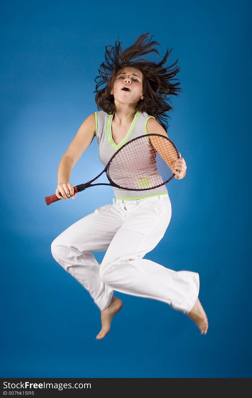 Happy woman with tennis racket on the blue background