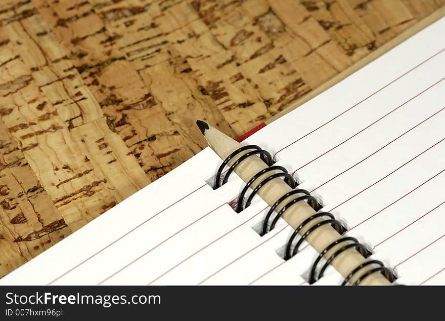 Photo of a Open Notebook with a Wooden Pencl. Photo of a Open Notebook with a Wooden Pencl