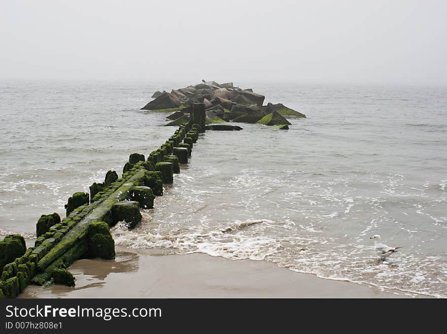 Lonely pier jutting out into ocean