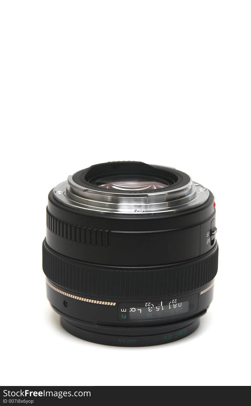 50mm lens laying down on its face with mount visible. 50mm lens laying down on its face with mount visible