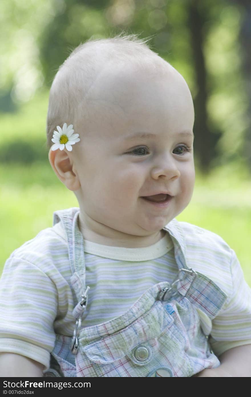 Daisybaby is smiling happily in park.