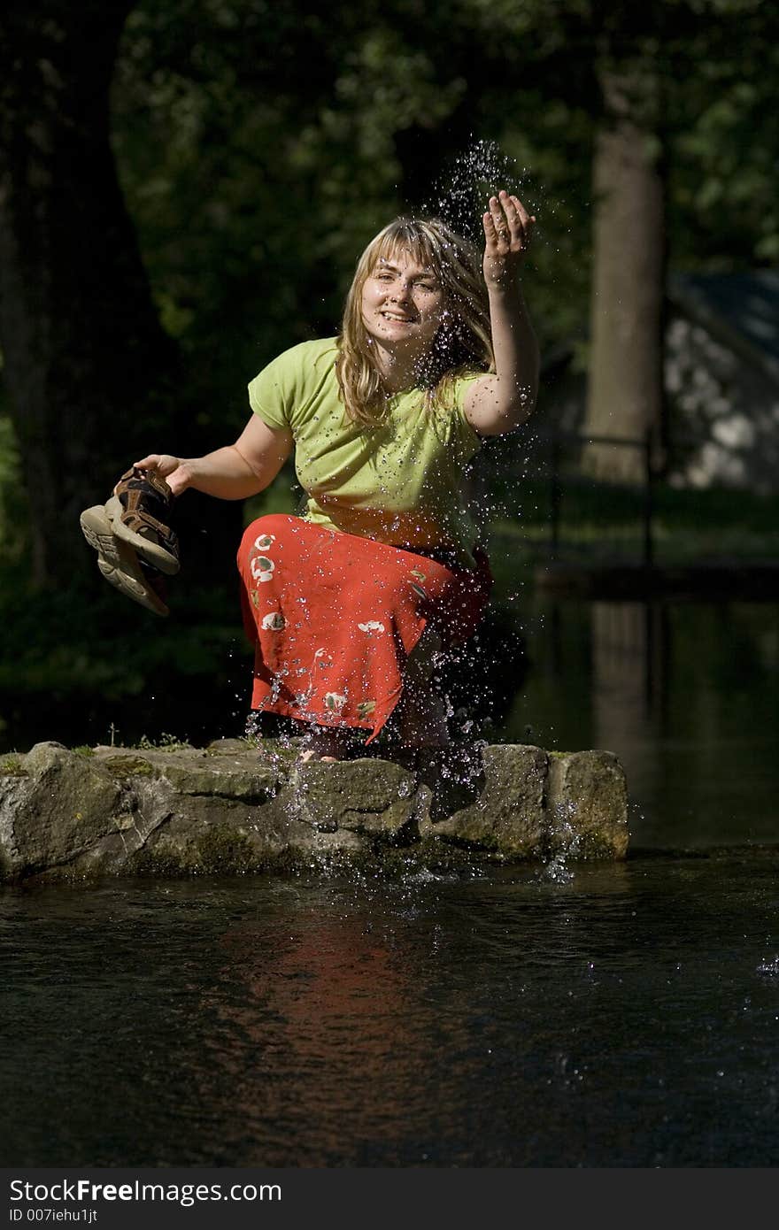 Woman is splashing a water. Woman is splashing a water.